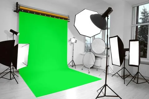 Chroma key compositing. Green backdrop and equipment in studio Stock Photos