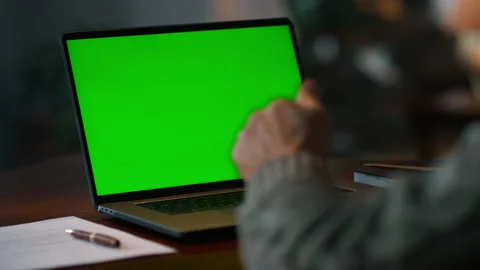 Chroma key computer closeup. Old man having video call at green screen laptop Stock Footage 160559742
