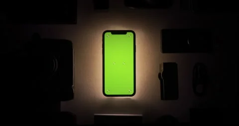 Chroma key, green screen closeup shot, glow phone, smartphone, smooth zoom in. Stock Footage 149445857