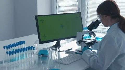 Chroma key green screen on computer monitor in chemical medical laboratory where Stock Footage 275191621
