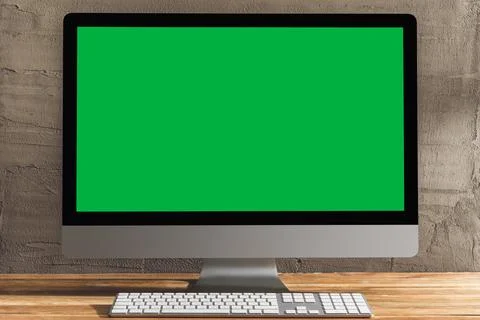 Chroma key green screen computer on table. Stock Photos