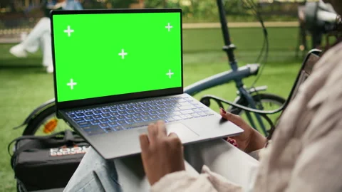 Chroma key green screen display on laptop used by delivery worker Stock Footage 343507236