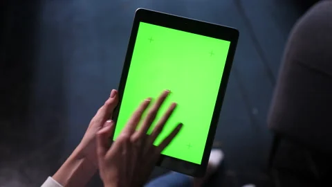 Chroma key green screen of ipad tablet computer. Female touches, taps, swipes. Stock Footage 166542902