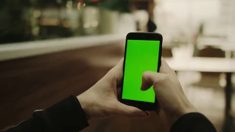 Chroma key green screen smartphone in the mall cafeteria Stock Footage 84689074