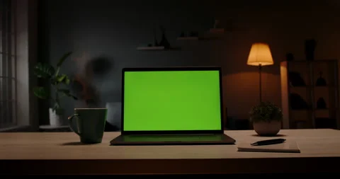 Chroma key green screen template - a laptop computer on a desk in cozy living Video stock 135912763