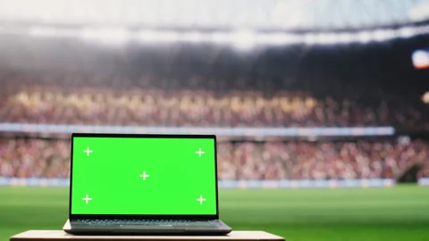 Chroma key isolated mockup on laptop on stadium grass pitch Stock Footage 337996198