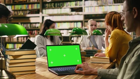 Chroma key isolated screen on laptop with student in over-the-shoulder shot Stock Footage 336359436