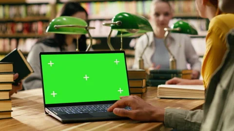 Chroma key isolated screen on laptop with student in over-the-shoulder shot Stock Footage 336361682