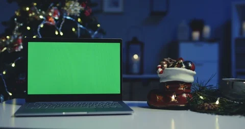 Chroma key on the laptop computer which is on the desk in the room decorated for Stock Footage 99808597