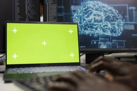 Chroma key laptop used by programmer in office automating tasks with AI Stock Photos