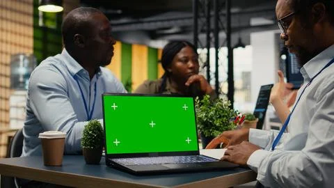 Chroma key laptop used by tech startup office engineer doing meeting Stock Photos
