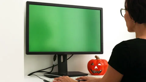 Chroma key mock-up on computer in the white home interior. Pumpkin on the table Stock Footage 219791349