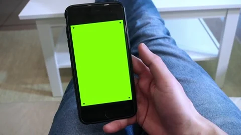 Chroma key mock-up on smartphone in hand. Woman holds mobile phone Stock Footage 265149660