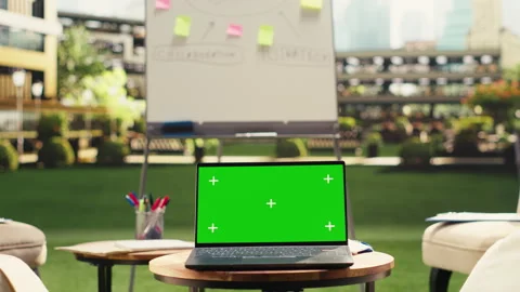 Chroma key mockup laptop on round table near lounge chairs Stock Footage 338379714