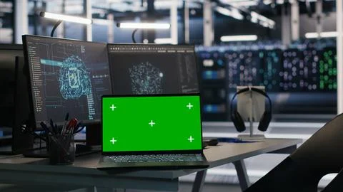 Chroma key notebook and PCs in high tech data center workspace Stock Photos