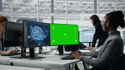 Chroma key PC, reviewing microchip production and RD factory specialist using AI Stock Footage 335880523