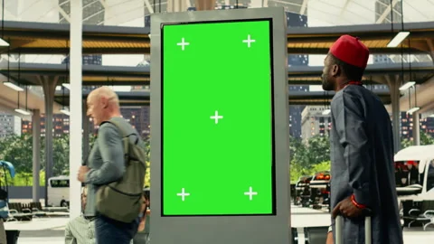 Chroma key screen in busy bus station with diverse people using bus connections Stock Footage 334728673