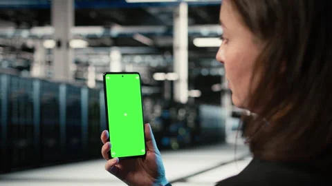 Chroma key smartphone, troubleshooting rigs issues and admin in data center Stock Footage 329333717