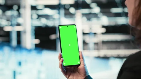 Chroma key smartphone used by data center admin to troubleshoot rigs issues Stock Footage 329324079
