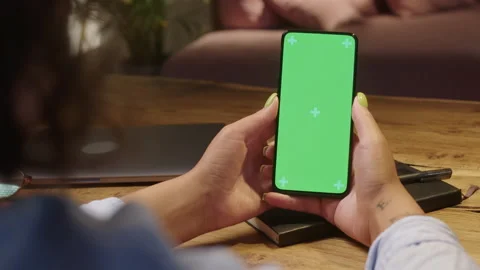 Chroma Key Swipe Up. Back View of Woman at Living Room Using Phone With Green Stock Footage 205850298