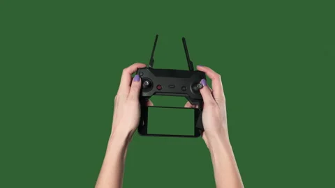 Chromakey. Green screen. Remote from quadrocopter in the hands of woman. Stock Footage 106079416