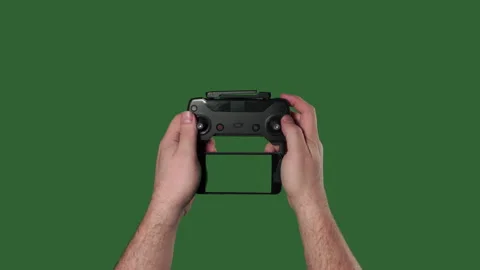 Chromakey. Green screen. Remote from quadrocopter in the hands of man. Stock Footage 106283774