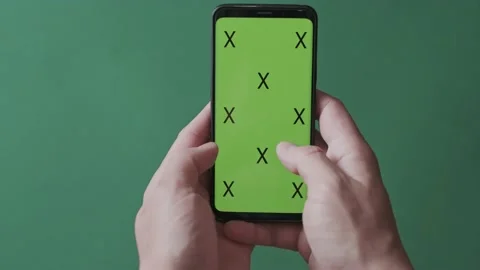 Chromakey with markers, a man's hand scrolls up and down the image on a smart Stock Footage 136650580