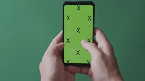 Chromakey with markers, a man's hand scrolls the image on a smartphone Stock Footage 136650583