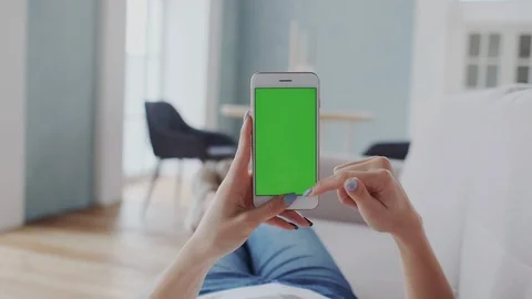 Chromakey or Greenscreen Touchpad on Handheld Cellphone or Smartphone. Feminine Stock Footage 122415116