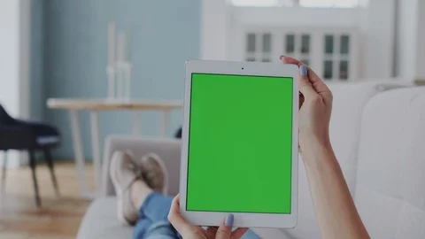 Chromakey or Greenscreen Touchpad on Tablet PC. Girl Turns Tablet PC from Stock Footage 122417166