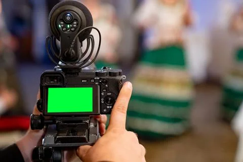 Chromakey screen on a video camera when shooting a performance at a holiday. Stock Photos