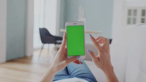 Chromakey Tracking or Green Screen. Adult Girl Touches Smartphone. Using Stock Footage 122415497