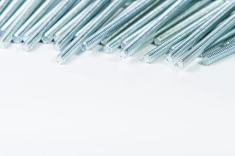 Chrome bolts on plain background Stock Photos