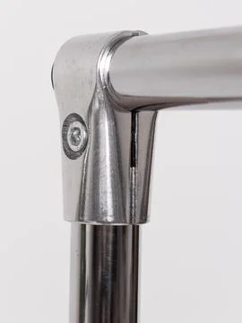 Chrome clothing rack base, angled view Stock Photos