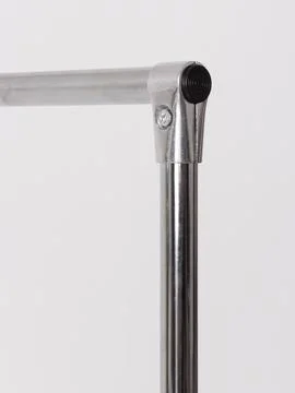 Chrome clothing rack corner, diagonal view Stock Photos