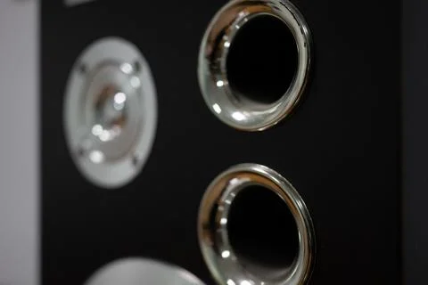 Chrome elements of music speakers close-up. Selective focus, soft focus, bokeh Stock Photos