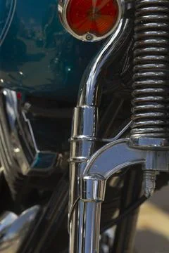 Chrome front fork and coil spring on motorcycle close-up, detail Foto stock