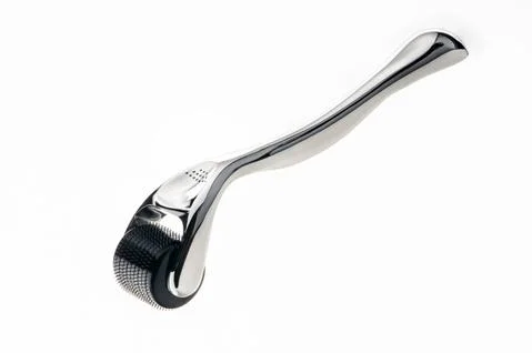Chrome mesoroller on a white background Stock Photos