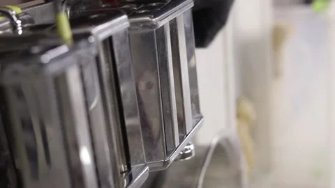 Chrome pasta machine processed Italian spaghetti. Reels. Stock Footage 234192685