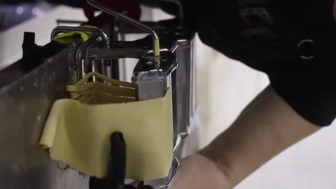 Chrome pasta machine processed Italian spaghetti. Reels. Stock Footage 234192716