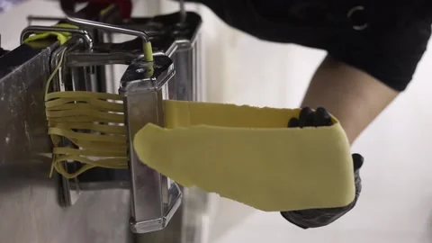 Chrome pasta machine processed Italian spaghetti. Reels. Stock Footage 236418523