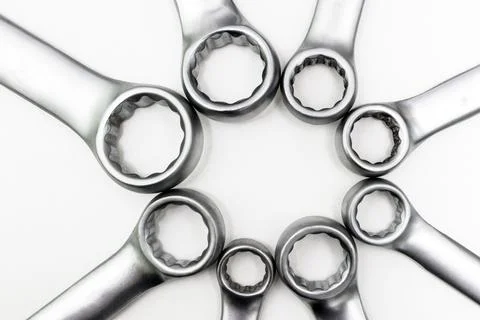Chrome ring spanners of various sizes were in contact with each other. Stock Photos