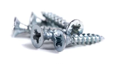 Chrome screw on white background. Tapping screws from steel close-up Stock-Fotos