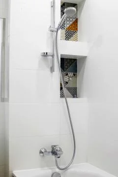Chrome shower in the bathroom Stock Photos