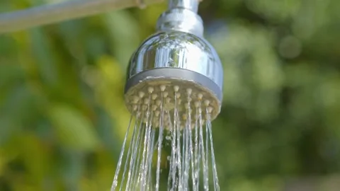 Chrome shower head with water streaming down in 4k slow motion 120fps Video stock 267690508
