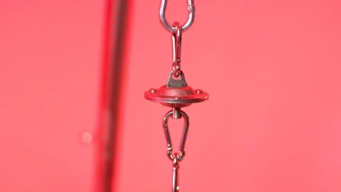 Chrome Snap Hook and Red Metal Fitting, Pink Background, Macro Close Up Vídeo Stock 341512919