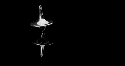 Chrome Spinning Top on Black Reflective Surface. Stock Footage 329602701