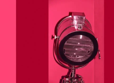 Chrome stage light on red background. Stock Photos