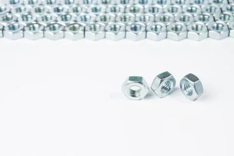 Chrome three nuts solated on white background Stock Photos