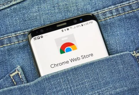 Chrome Web Store on a phone screen in a pocket Stock Photos